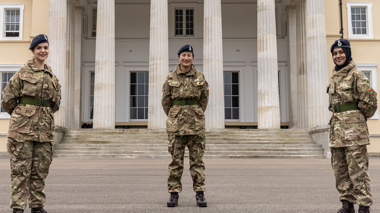 Midya Masti (left) stands at the parade square of Sandhurst along with two other female cadets graduating from the elite military academy, March 20, 2021. (Photo: British Army)