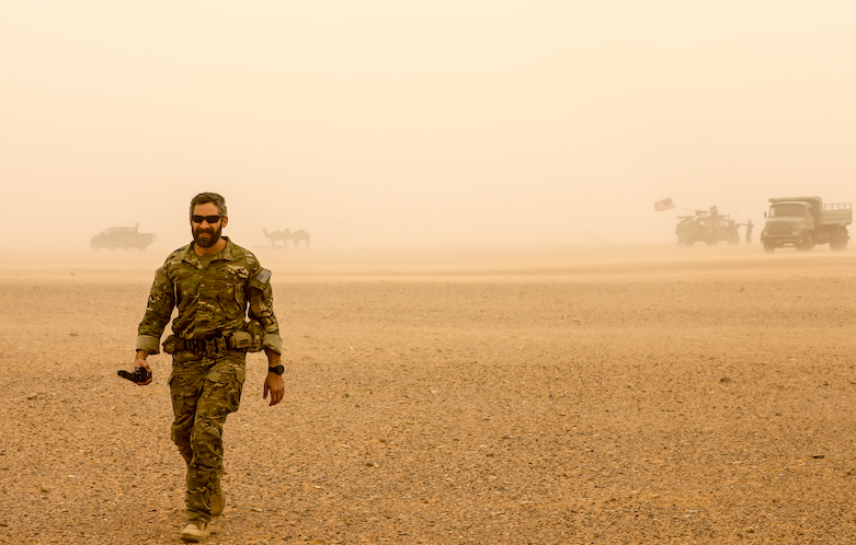 A US Special Forces Soldier walks through a windy desert from meeting with locals in Syria, March 2018. (Photo: Staff Sgt. Christopher Brown/US 5th Special Forces Public Affairs Office)