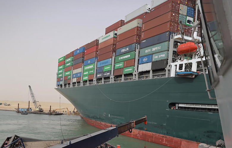 An operation was underway on March 25, 2021 to try to free the Panama-flagged Ever Given cargo ship which became wedged in the Suez Canal and blocked the vital shipping route. (Photo: Suez Canal Authority via AP)