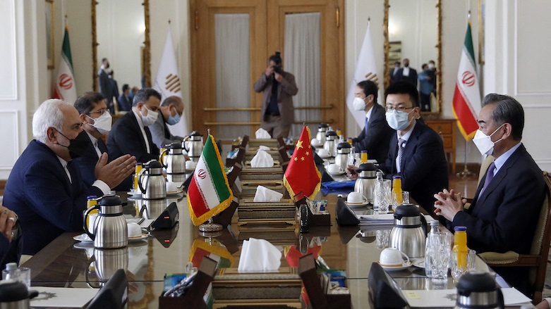 Iranian Foreign Minister Mohammad Javad Zarif (L) meets with his Chinese counterpart Wang Yi (R), in the capital Tehran as Iran and China signed a “25-year strategic cooperation pact” on March 27, 2021. (Photo: AFP)