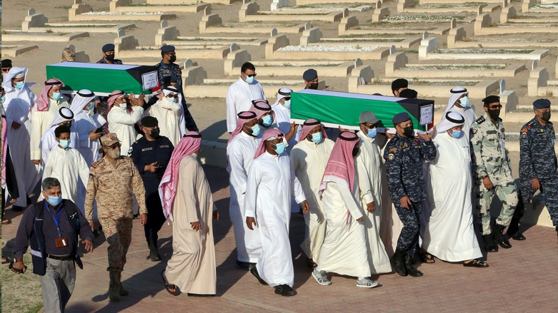 Families carry the coffins of Kuwaiti prisoners of war whose remains were found in a mass grave in Iraq and identified following a DNA test in Kuwait City, Nov. 23 2020. (Photo: Yasser Al-Zayyat/AFP)