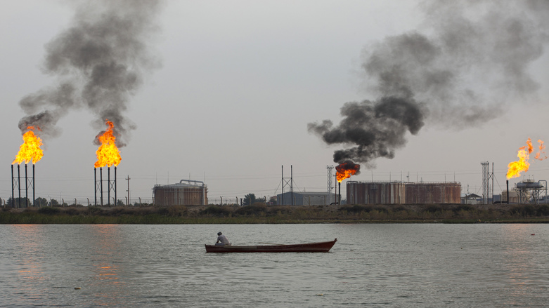A boat sails past the Umm Qasr port near Iraq's southern port city of Basra on Feb. 11, 2022. (Photo: Hussein Faleh/AFP)