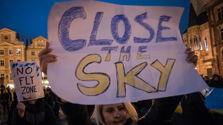 A protester holds a placard calling for a no fly zone over Ukraine during a demonstration in support to Ukraine on March 15, 2022 on the Old Town square in Prague. (Photo: Michal Cizek/AFP)