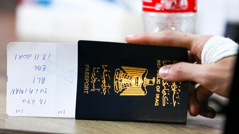An Iraqi man holding his travel document at an airport. (Photo: AP)