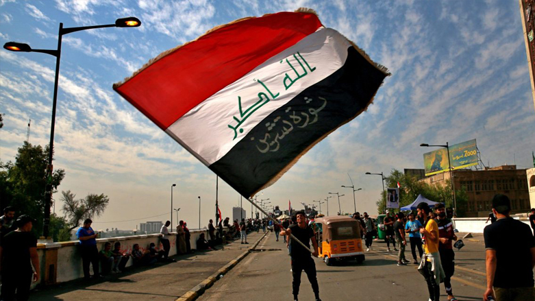 Anti-government protesters gather on the closed Joumhouriya Bridge that leads to the Green Zone government areas in Baghdad, Iraq, Oct. 25, 2020. (Photo: Khalid Mohammed/AP)