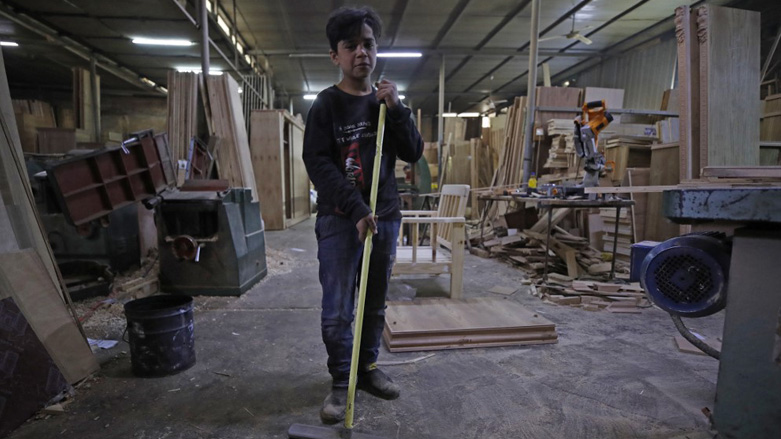 Haydar Karar works at a carpentry shop since age eight, in the capital Baghdad, Jan. 31, 2023. (Photo: Ahmad Al-Rubaye/AFP)