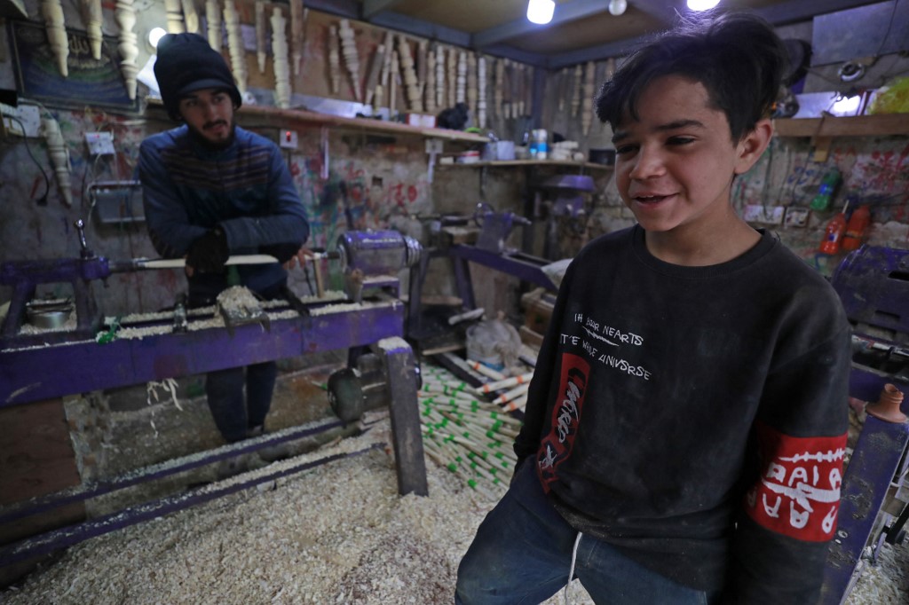 Haydar Karar works at a carpentry shop since age eight, in the capital Baghdad, Jan. 31, 2023. (Photo: Ahmad Al-Rubaye/AFP)