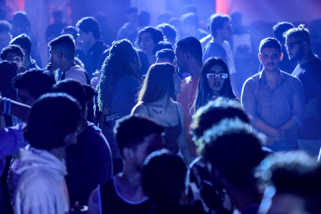 Youths attend the third edition of the Western Music Festival in Baghdad, March 10, 2023. (Photo: Murtaja Lateef/AFP)