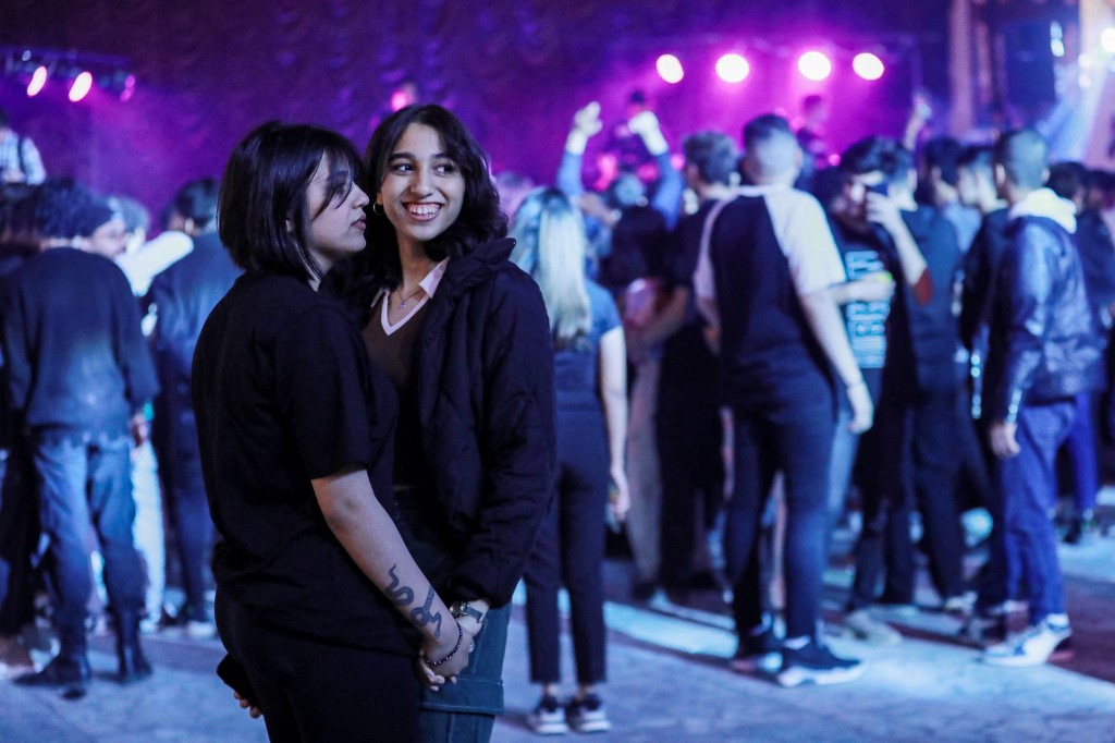 Young women attend the third edition of the Western Music Festival in Baghdad, March 10, 2023. (Photo: Murtada Lateef/AFP)