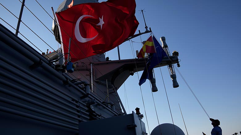 A naval officer checks the Turkish flag over a ship during an annual NATO naval exercise on Turkey's western coast on the Mediterranean, Thursday, Sept. 15, 2022. (Photo: Khalil Hamra/ AP)