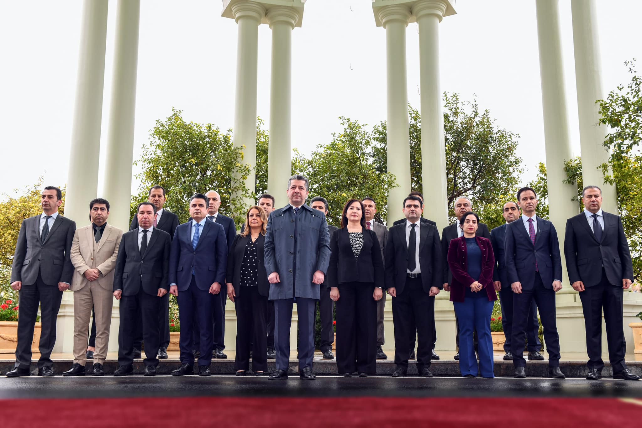 Kurdistan Region Prime Minister Masrour Barzani (center) standing to observe a moment of silence for the victims of Halabja genocide, March 16, 2023. (Photo: KRG)