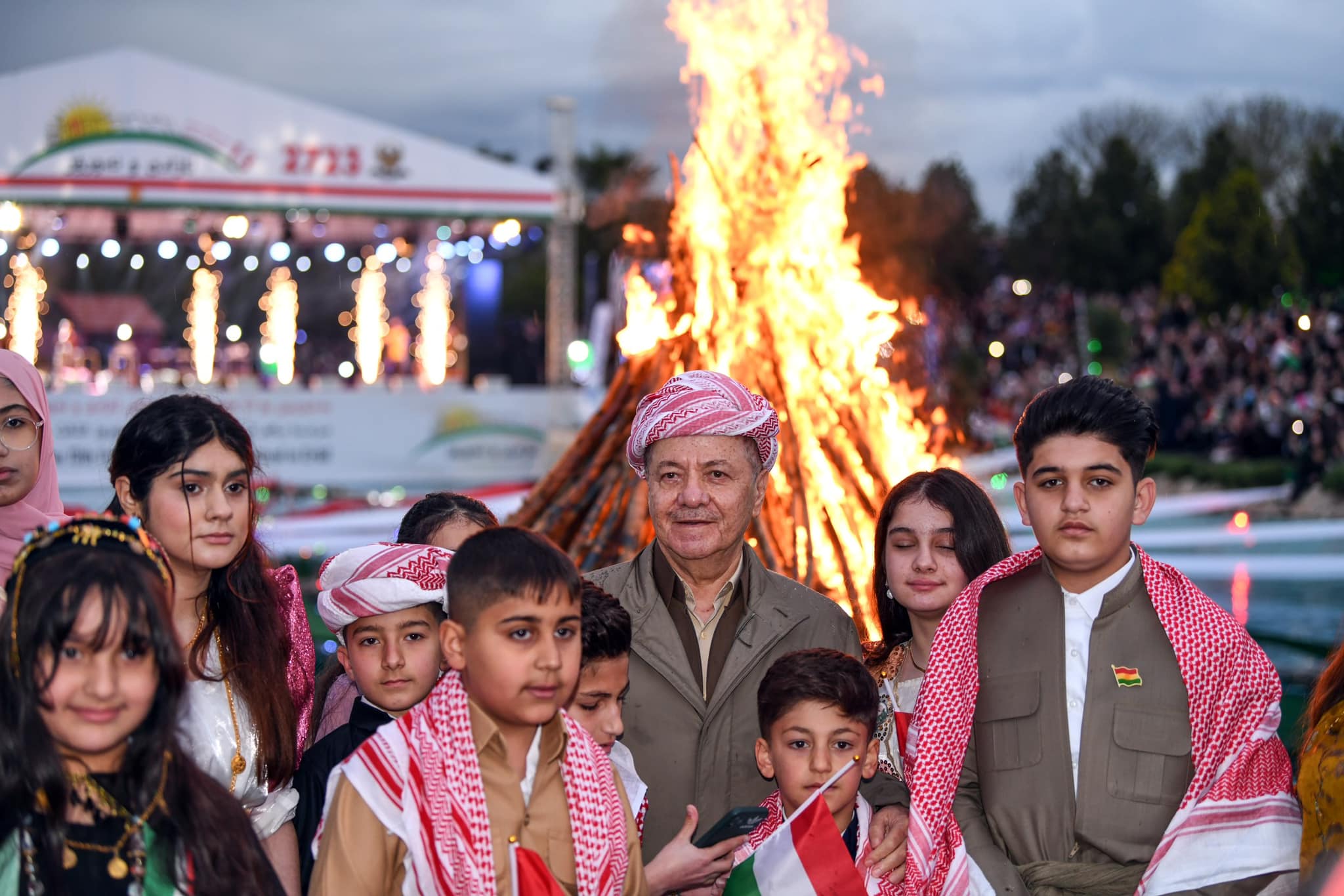 Kurdistan Democratic Party (KDP) President Masoud Barzani (center) posing for a group photo with the children of martyrs in Erbil, March 20, 2023. (Photo: KRG)