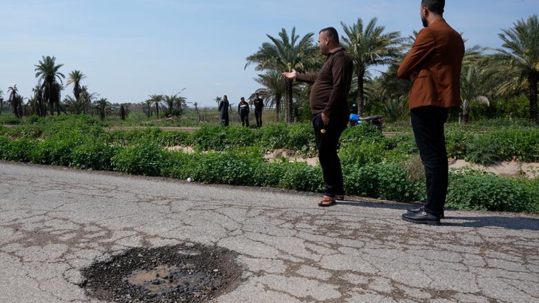 Relatives of people killed in a car by planted explosive visit the scene in Muqdadiyah, Iraq, Wednesday, March 22, 2023. (Photo: Hadi Mizban/ AP)