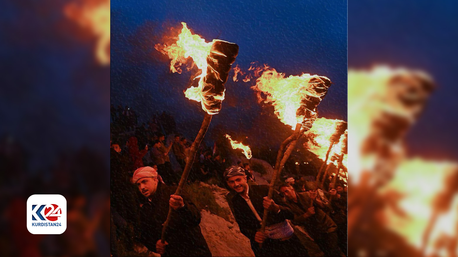 People carrying fire torches during the Newroz celebration. (Photo: Kurdistan24)