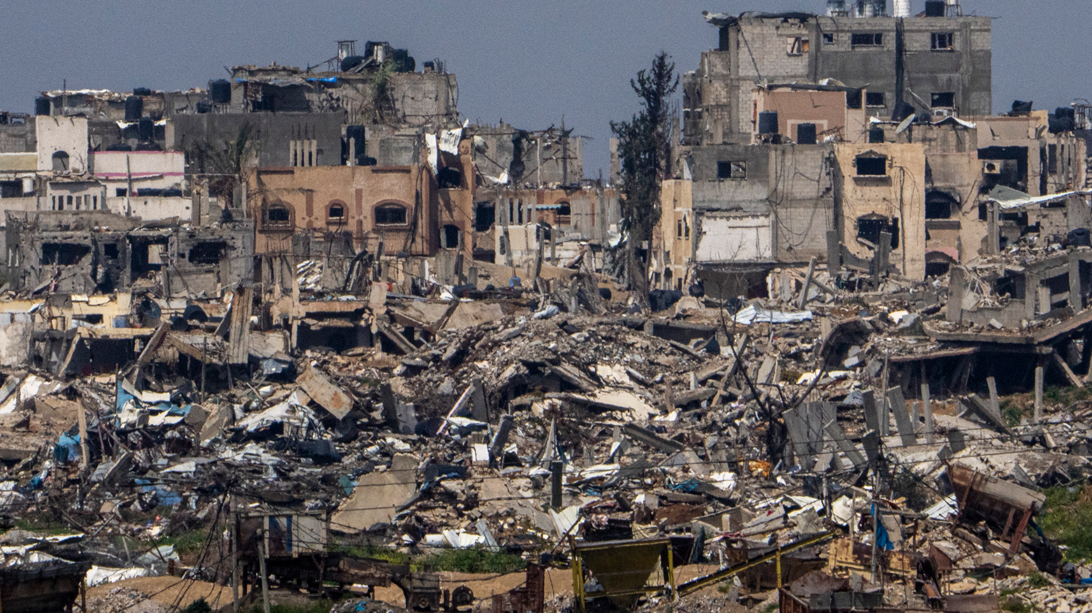 Destroyed buildings stand inside Gaza Strip, as seen from southern Israel, March 19, 2024. (Photo: AP)