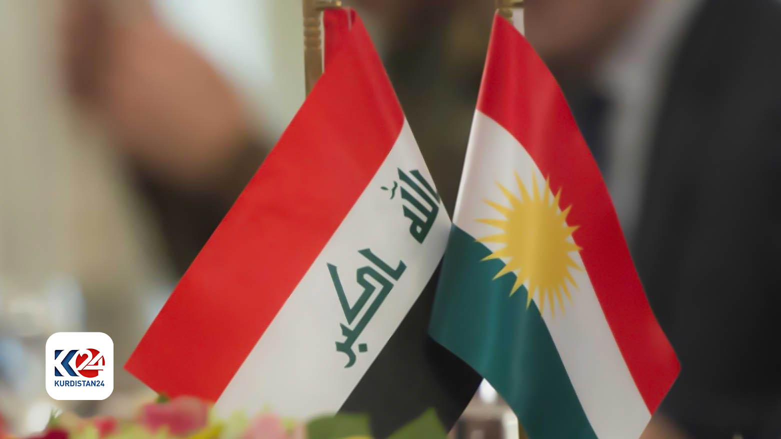 Kurdistan Region flag (right) is placed next to Iraqi flag in Erbil. (Photo: AFP)