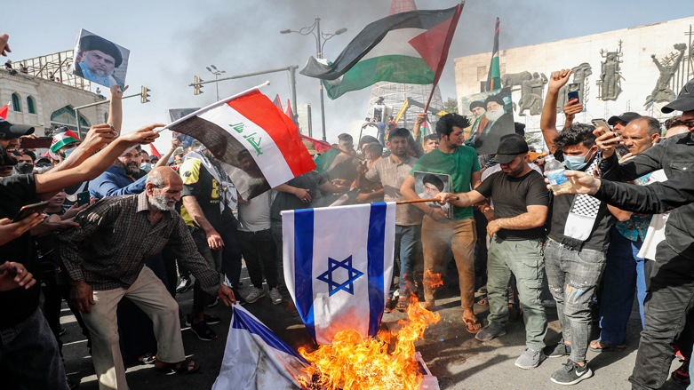 Iraqis set Israeli flags on fire during a solidarity march with the Palestinians, in the capital Baghdad on the 73rd anniversary of the Nakba, the "catastrophe" of Israel's creation in 1948, May 15, 2021. (Photo: Ahmad AL-Rubaye / AFP