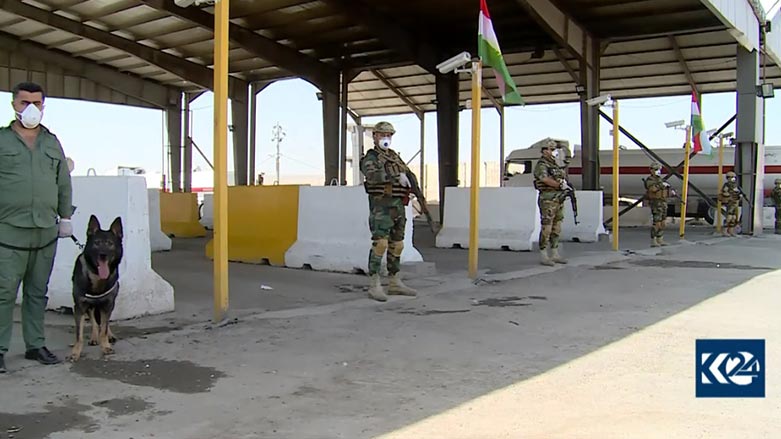 Kurdistan Region security members stand guard at Sherawa checkpoint in south of Erbil, the capital of Kurdish region. (Photo: Kurdistan 24)