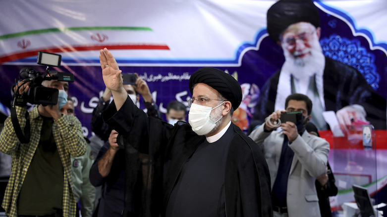 Ebrahim Raisi, head of Iran’s judiciary, waves to media as he registers his candidacy for the June 18 presidential elections, May 15, 2021. (Photo: Ebrahim Noroozi/AP)