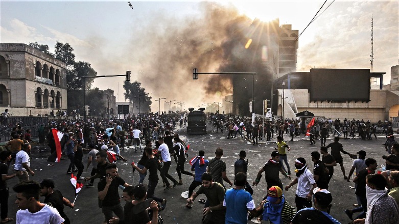 A riot police vehicle attempts to disperse a demonstration in central Baghdad's Tahrir Square. (Photo: AFP)