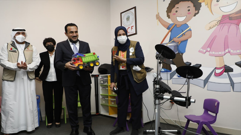 Erbil Governor Omed Khoshnaw holds a child's toy truck during the inauguration of the Emirati Autism Center in the Kurdistan Region's Erbil, May 26, 2021. (Photo: Erbil Governorate)