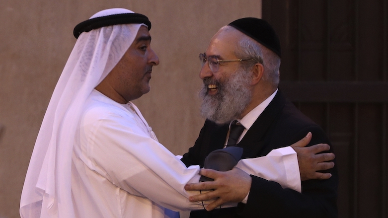 Ahmed Al Mansuri, founder of Crossroads of Civilization private museum, left, greets a rabbi at an exhibition commemorating the Jewish Holocaust in Dubai, UAE, May 26, 2021. (Photo: Kamran Jebreili/AP)