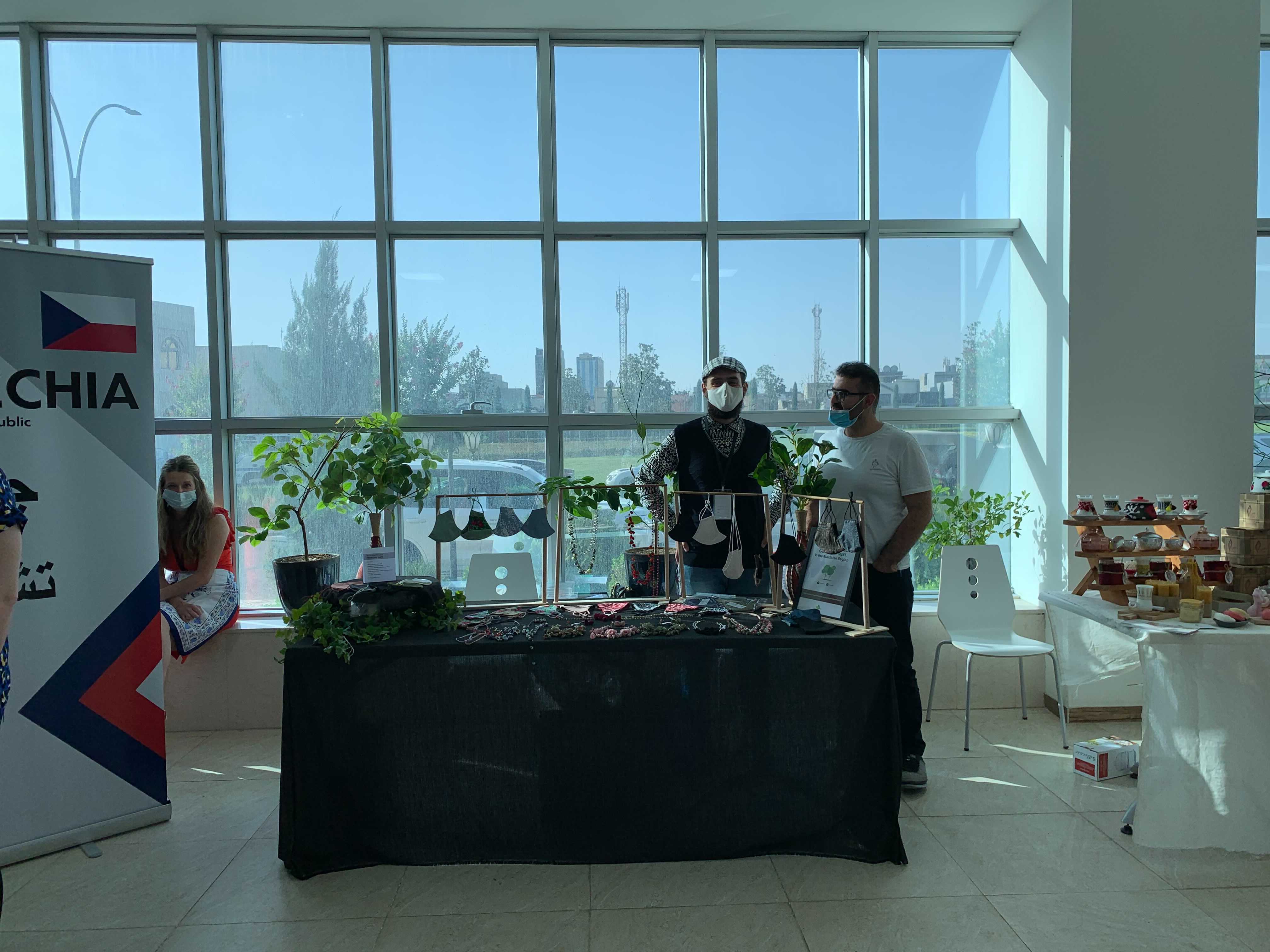 A business selling face masks with various designs, including a traditional checkered Kurdish pattern locally known as Jamana, displays products at the Diplomatic Friendship Bazaar in Erbil. (Photo: Halgurd Sherwani/Kurdistan 24)