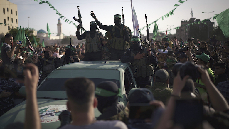 Palestinians watch a Hamas rally just over a week after a ceasefire was reached in an 11-day war between Hamas and Israel, May 30, 2021, in Beit Lahia, northern Gaza Strip. (Photo: Felipe Dana/AP)