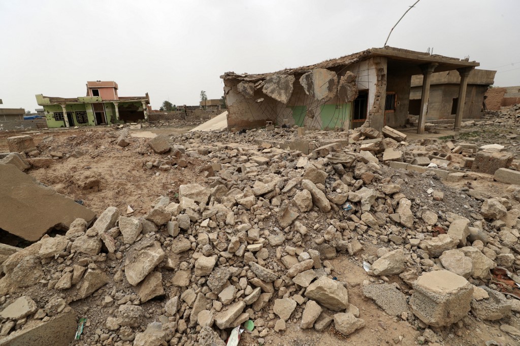 A general view shows damaged houses in the war-ravaged village of Habash, on April 25, 2022. (Photo: Ahmad Al-Rubaye/AFP)