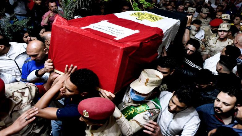 Men carry the coffin of military solider Ahmed Mohamed Ahmed Ali, who was killed in battle, during his funeral service, in Qalyubia province, Egypt, Sunday, May 8, 2022 (Photo: Sayed Hassan/AP)
