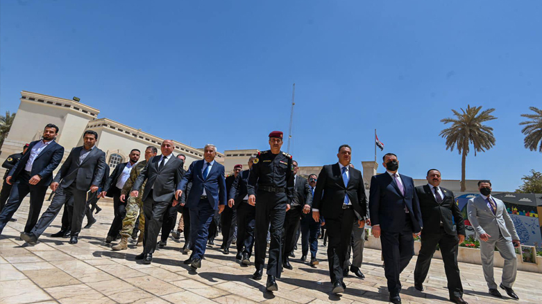 Iraqi and Kurdistan Region security and intelligence officials walk alongside each other in the counter terrorism headquarters in Baghdad, May 9, 2022. (Photo: Handout/ICST)