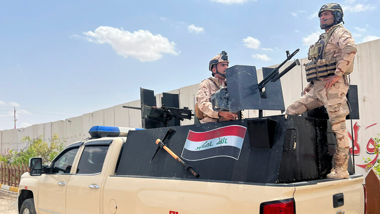 Iraqi soldiers stand on a truck by a base in Sinjar, Iraq, Tuesday, May 3, 2022. (Photo: Ali Abdul Hassan/AP)