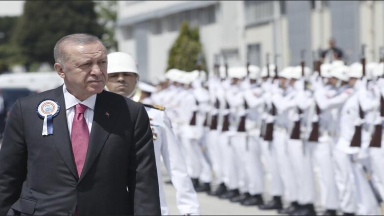 Turkish President Recep Tayyip Erdogan inspects a military honour guard during a ceremony marking the docking of a submarine, in Kocaeli, Turkey, Monday, May 23, 2022 (Photo: Turkish Presidency via AP Photo)