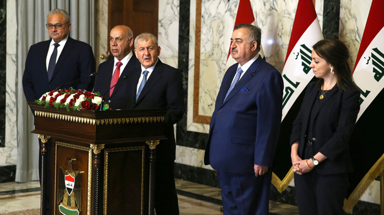 Iraqi President Abdul-Latif Rashid (center) speaking at a press conference announcing the recovery of 6,000 artifacts, May 9, 2023. (Photo: Iraqi presidency)