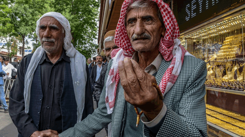 Mehmet Emin Yilmaz (R), a Kurdish farmer, speaks during an interview in Diyarbakir, southeastern Turkey, on April 28, 2023 (Photo: ILYAS AKENGIN / AFP)