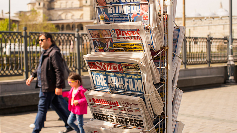 People walk past a rack with Turkish newspapers a day after the presidential election day, in Istanbul, Turkey, May 15, 2023. (Photo: Emrah Gurel/ AP)
