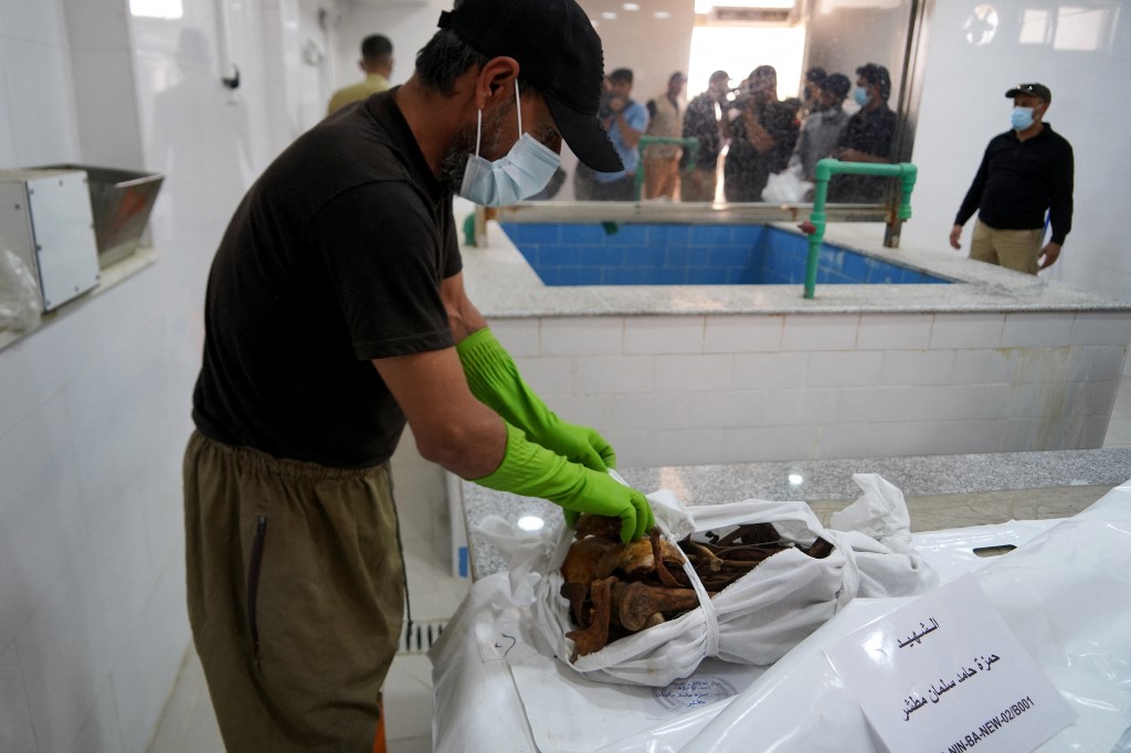 The remains of inmates of the Badush prison, killed in Mosul by Islamic State (IS) group jihadists in 2014 and found in mass graves in 2017, May 16, 2023. (Photo: Qassem Al-Kaabi/AFP)