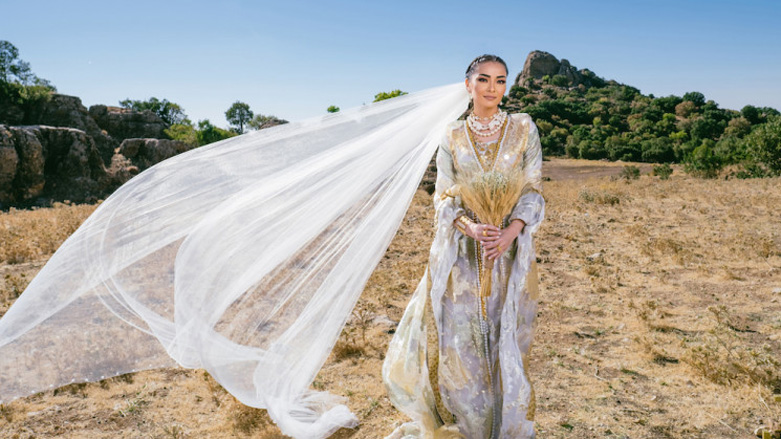 A Kurdish model, wearing a Kurdish dress designed by Lara Dizeyee, poses for a photo atop of Mount Safeen in the Kurdistan Region's Erbil province. (Photo: Courtesy of Lara Dizeyee)