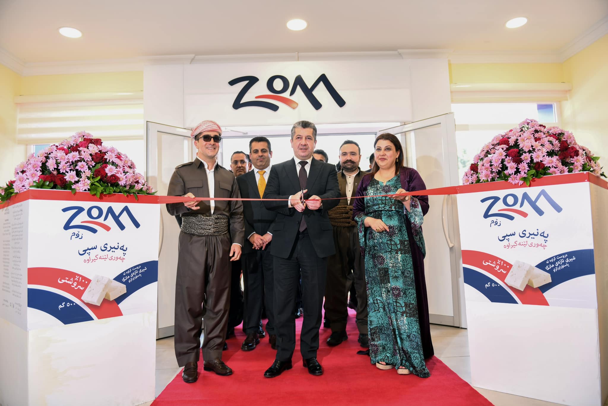 Kurdistan Region Prime Minister Masrour Barzani (center) cutting inauguration ribbon of Zom Factory for dairy products in Erbil province, May 30, 2023. (Photo: KRG)