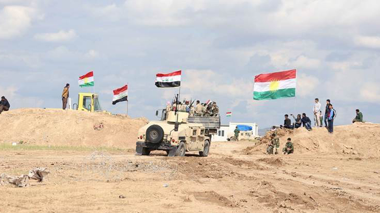 تیپ های مشترک نیروی پیشمرگ کوردستان و ارتش عراق در هنگام انجام عملیات مشترک در یکی از مناطق