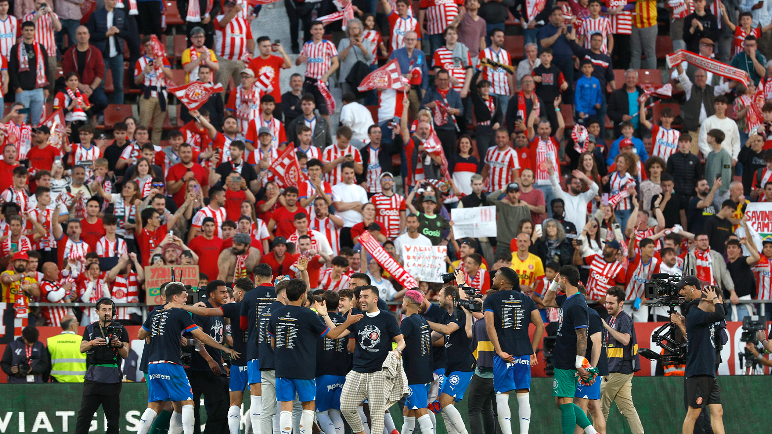 Girona team players celebrate in front of their supporters. (Photo: AP)