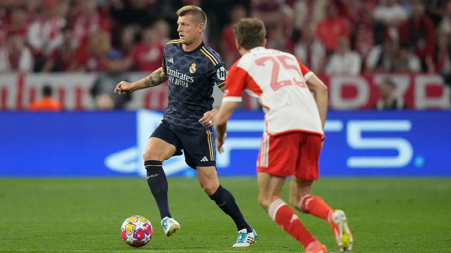 Real Madrid's Toni Kroos, left, controls the ball in front Bayern's Thomas Mueller during the Champions League semifinal first leg. (Photo: AP)