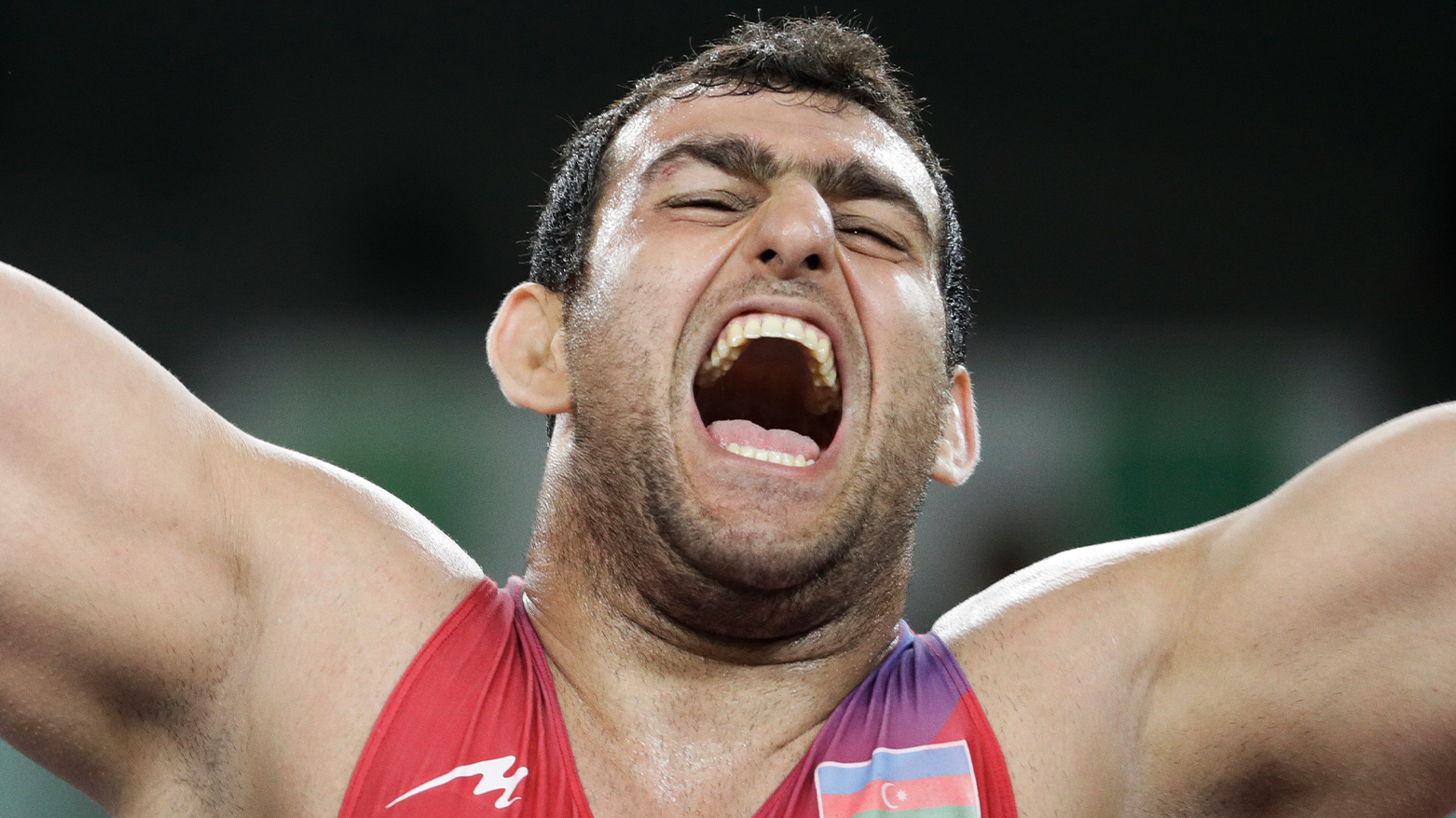 Azerbaijan's Sabah Shariati celebrates after winning the bronze medal during the men's wrestling Greco-Roman 130-kg competition. (Photo: AP)