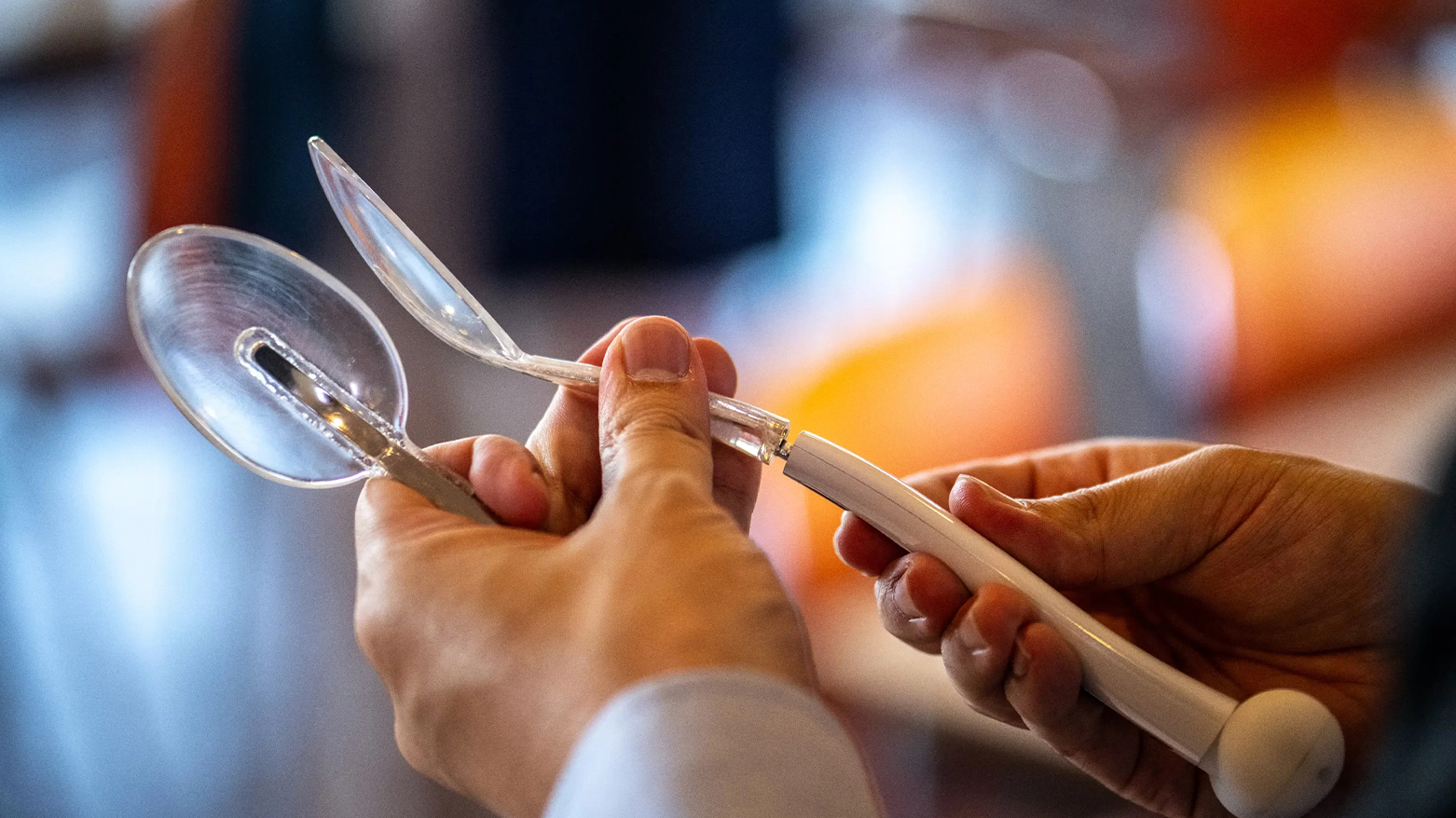 A restaurant staff member preparing electric spoons that enhance the salty taste of low-sodium food. (Photo: AFP)