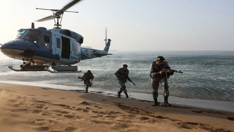 This handout image provided by the Iranian Army Office on November 7, 2021, shows Iranian soldiers participating in a military exercise on the shore of the Sea of Oman in the coastal region of Baluchistan. (Photo: Iranian Army office / AFP)