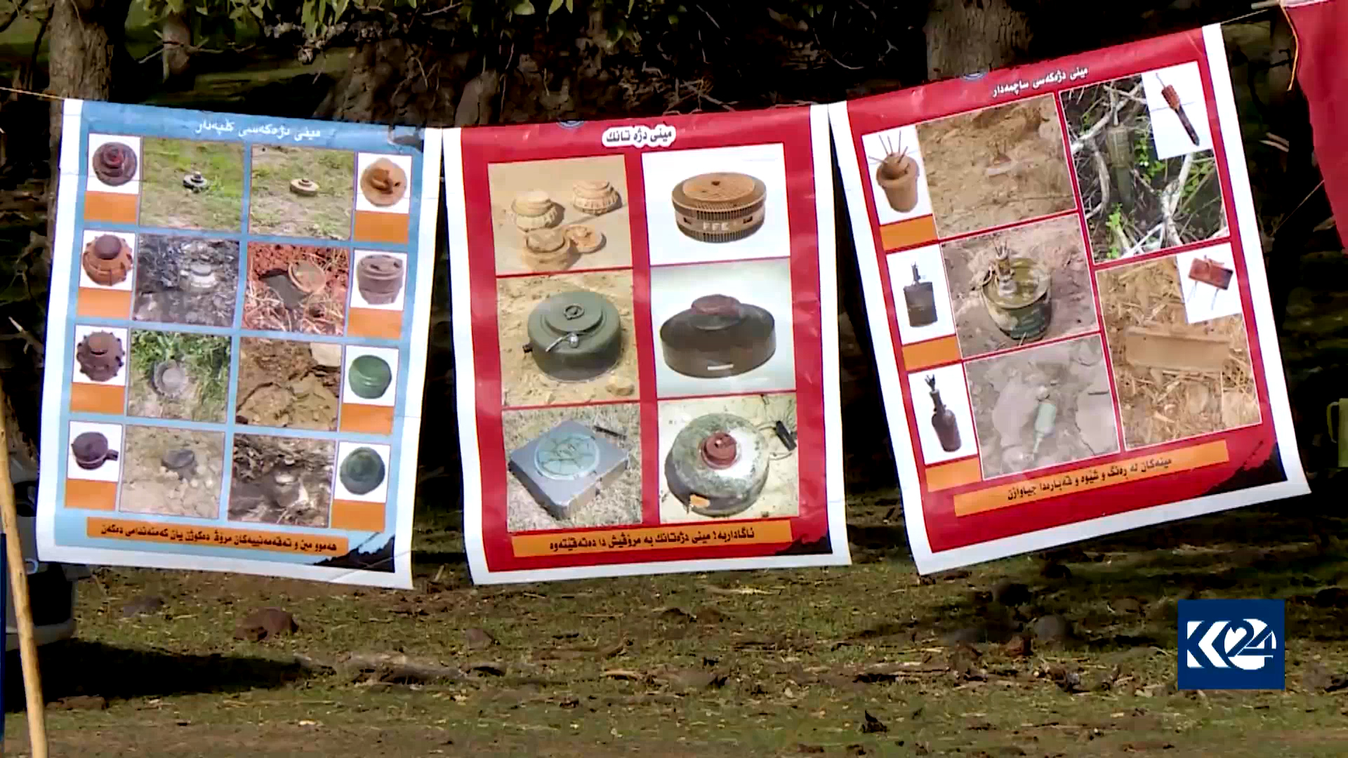 Posters depicting various kinds of landmines hanged for explanation for a rural audience, Nov. 11, 2021. (Photo: Kurdistan 24)