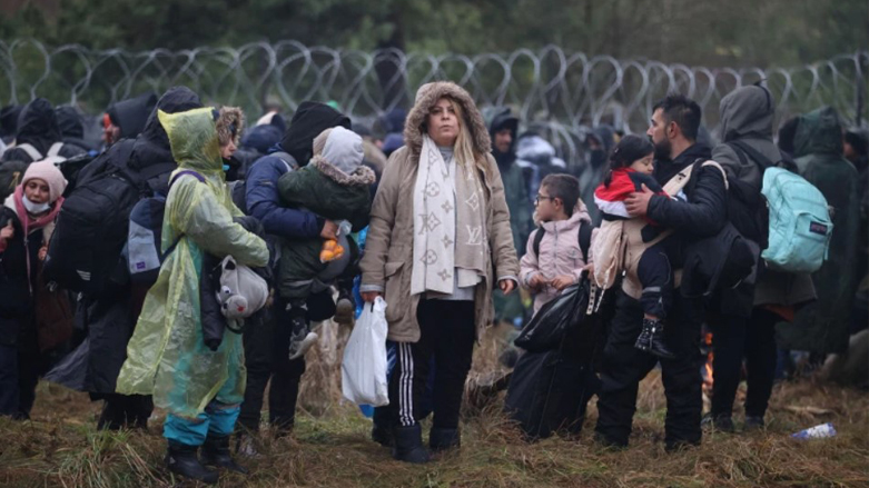 Migrants and refugees on Poland-Belarus border, who face subzero temperatures and a lack of food and medical attention (Photo: Leonid Scheglov/AFP)