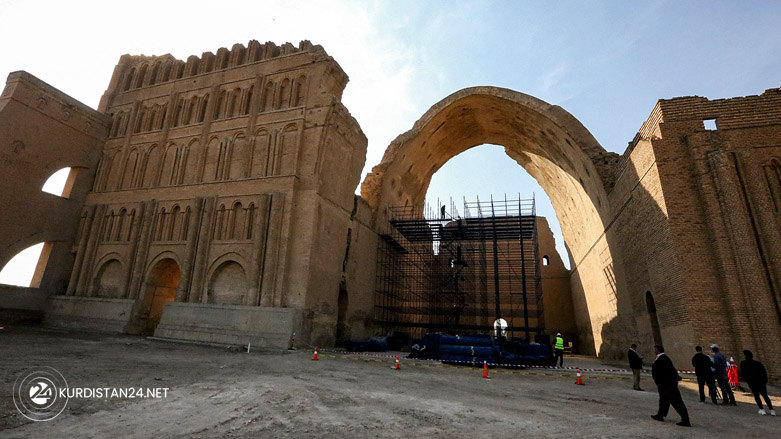 the Arch of Ctesiphon, also known as Taq Kisra (Khosrow's Arch), stands before the conservators' scaffolding at the ancient site of Ctesiphon near moden al-Madain in central Iraq, Nov. 24, 2021. (Photo: Sabah Arar/AFP)