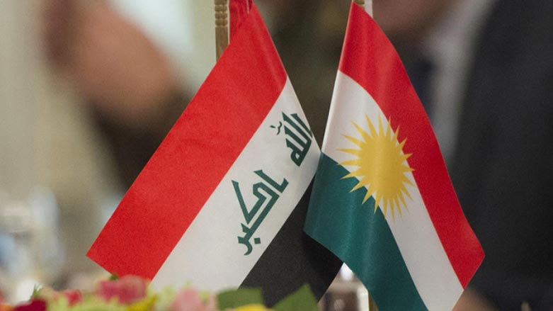 Iraqi flag (left) beside Kurdish flag (right).
