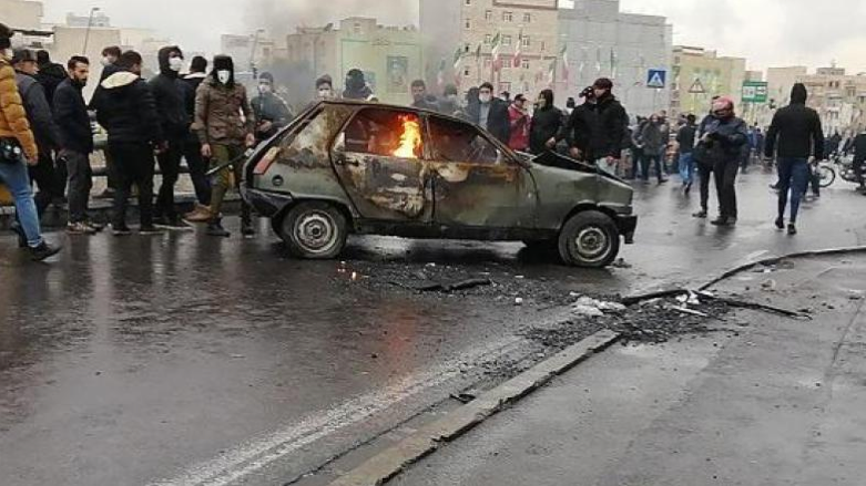 Iranian protesters gather around a burning car during a demonstration against an increase in gasoline prices in the capital Tehran, on November 16, 2019 (Photo: AFP/Getty Images)